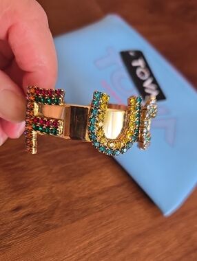 TOVA Gold-Tone Multicolor Crystal Bracelet With A Four Letter Word